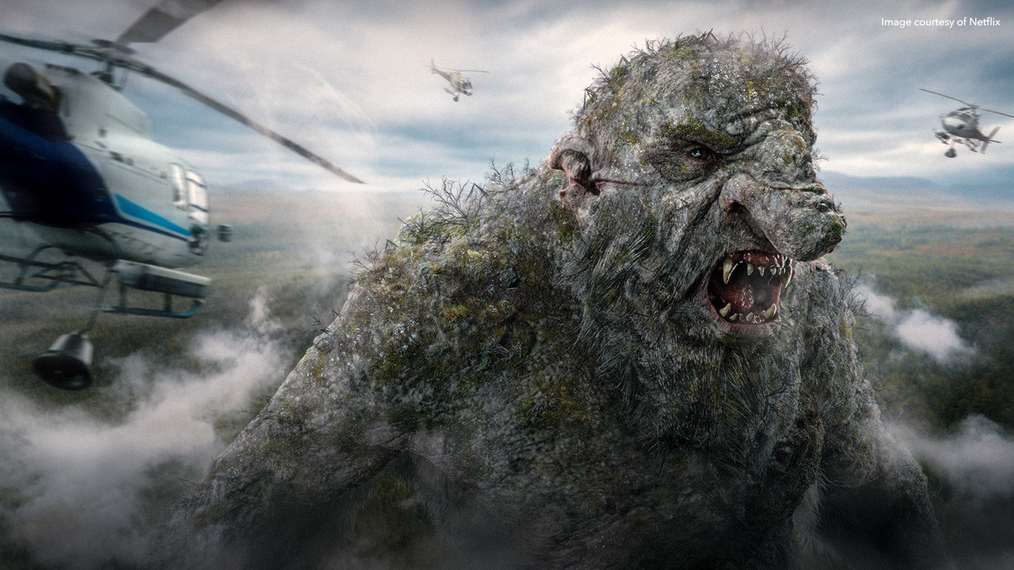Still from Netflix movie Troll, featuring Troll surrounded by helicopters 