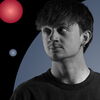 Artist Spotlight: Léo Châtel black and white portrait on black background with colored spotlights
